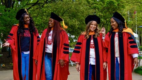 Students on graduation day walk on campus