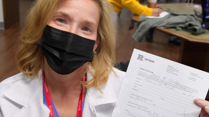 A photo subject showing her model release form