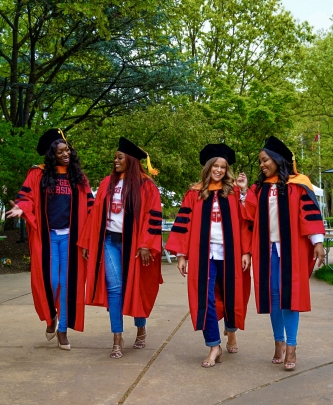 Students on graduation day walk on campus