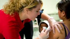 Nursing student delivers vaccine shot